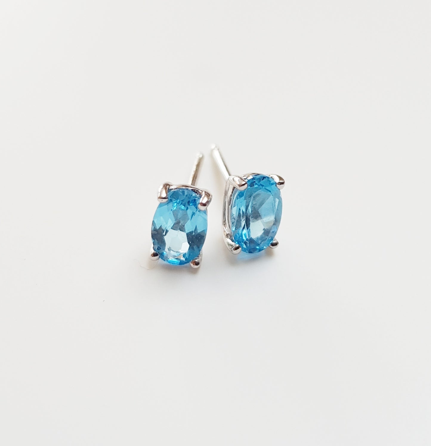 White Gold Blue Topaz Stud Earrings